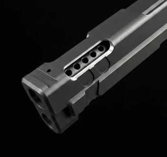 Compensating ports cut through a pistol barrel and slide