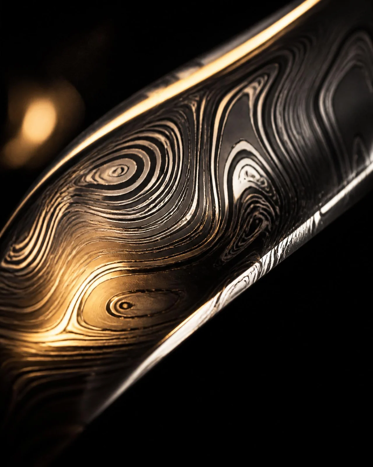 Hand-engraved Damascus steel detail from the JoShaiiia atelier